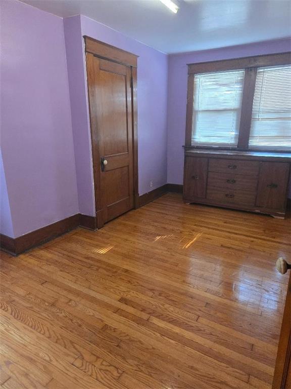 615 Morgantown Road Uniontown, PA 15401 - Photo 21 of 32 a view of an empty room with wooden floor and a window