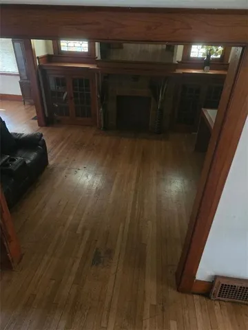 a view of a livingroom with furniture and staircase