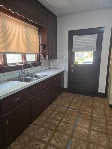 a kitchen with a sink and a window