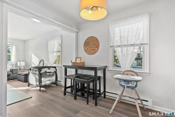 a view of a a dining room with furniture window and outside view
