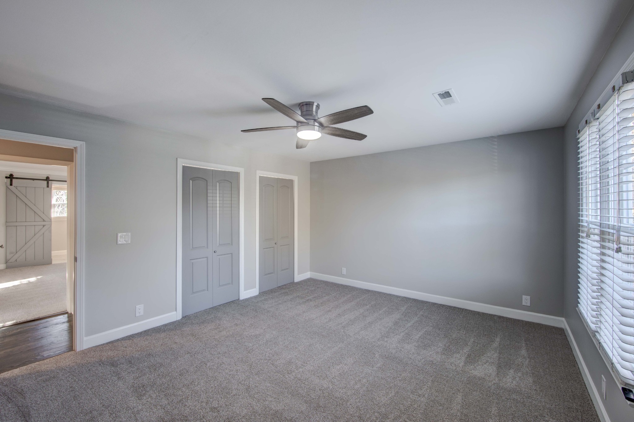 1129 West Main Street, Unit 4 Franklin, TN 37064 - Photo 19 of 27 an empty room with closet and ceiling fan