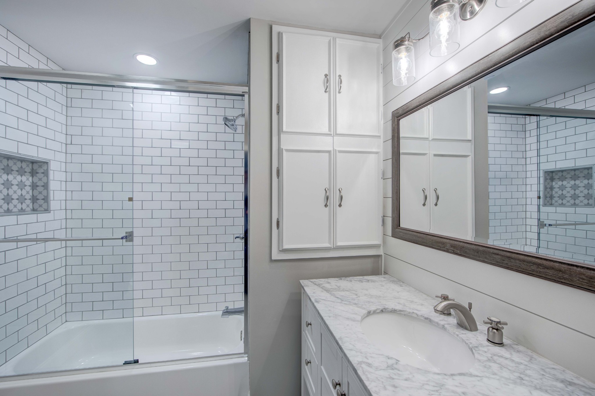 1129 West Main Street, Unit 4 Franklin, TN 37064 - Photo 20 of 27 a bathroom with a granite countertop sink a mirror and shower