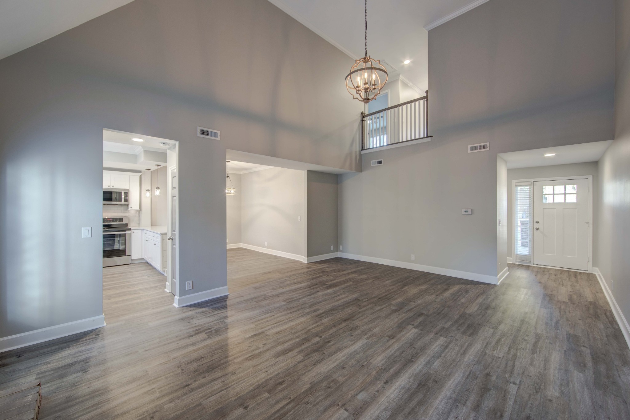 1129 West Main Street, Unit 4 Franklin, TN 37064 - Photo 10 of 27 an empty room with wooden floor and windows