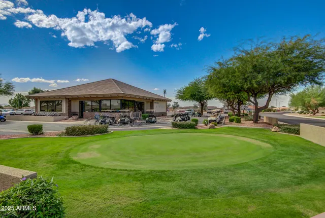 a room with pool table windows and a rug