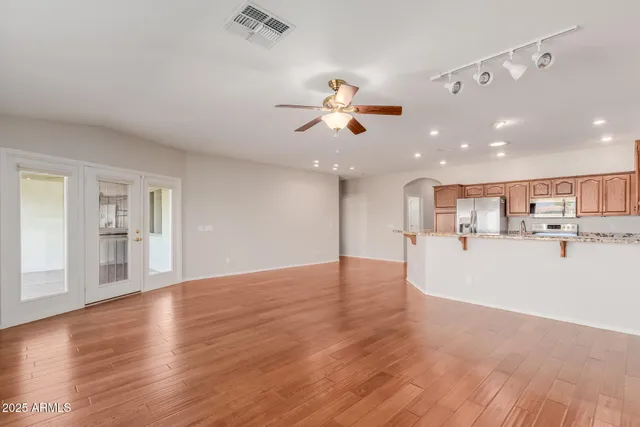 a view of a kitchen with a sink and a stove top oven