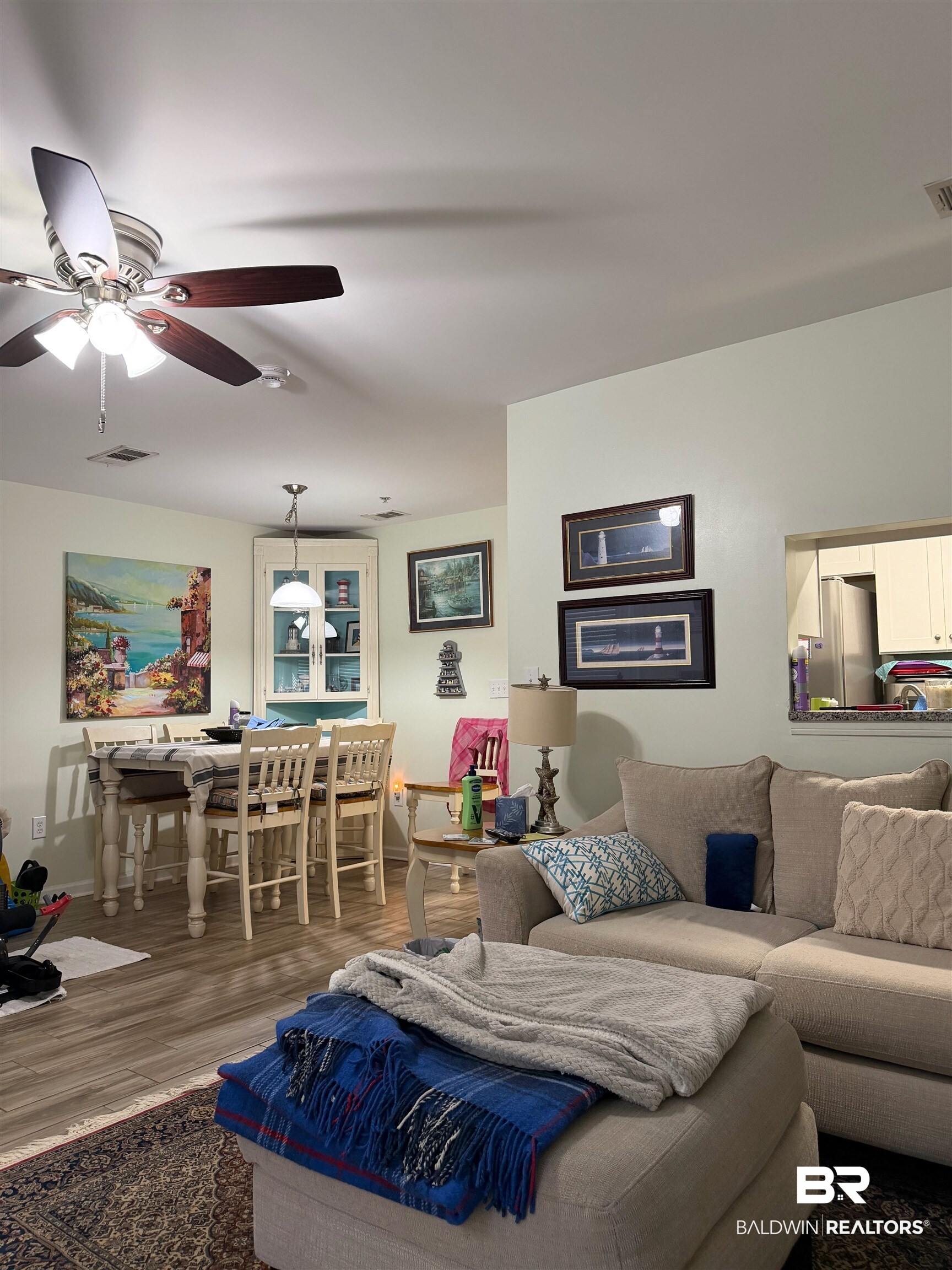 1517 Regency Road, Unit 71 Gulf Shores, AL 36542 - Photo 13 of 26 Living room with ceiling fan and wood finished floors