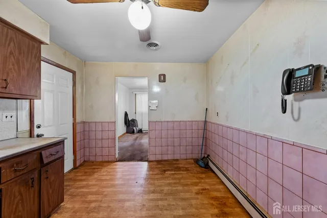 a view of a room with a sink and a dresser