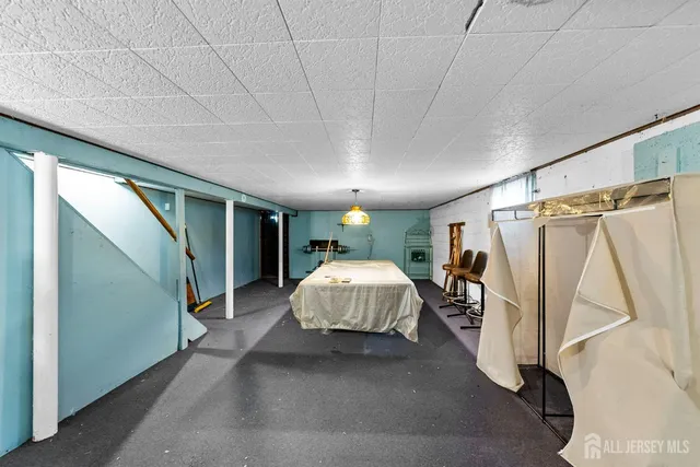 a view of a room with furniture and window