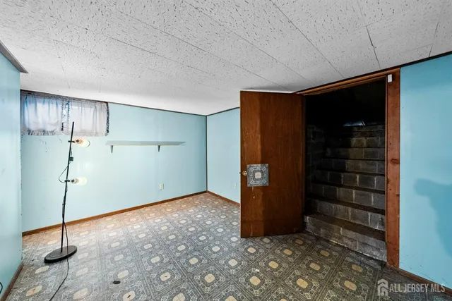 a view of a backyard with table and chairs and potted plants