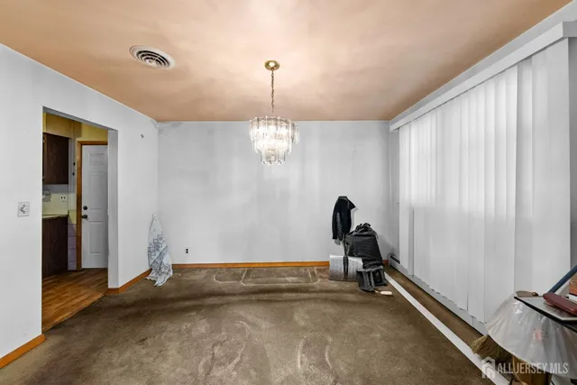 a room with gym equipment and mirrors