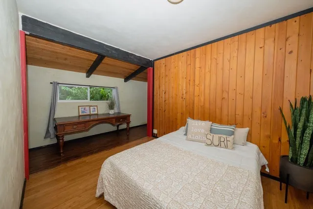 a view of a porch with wooden floor