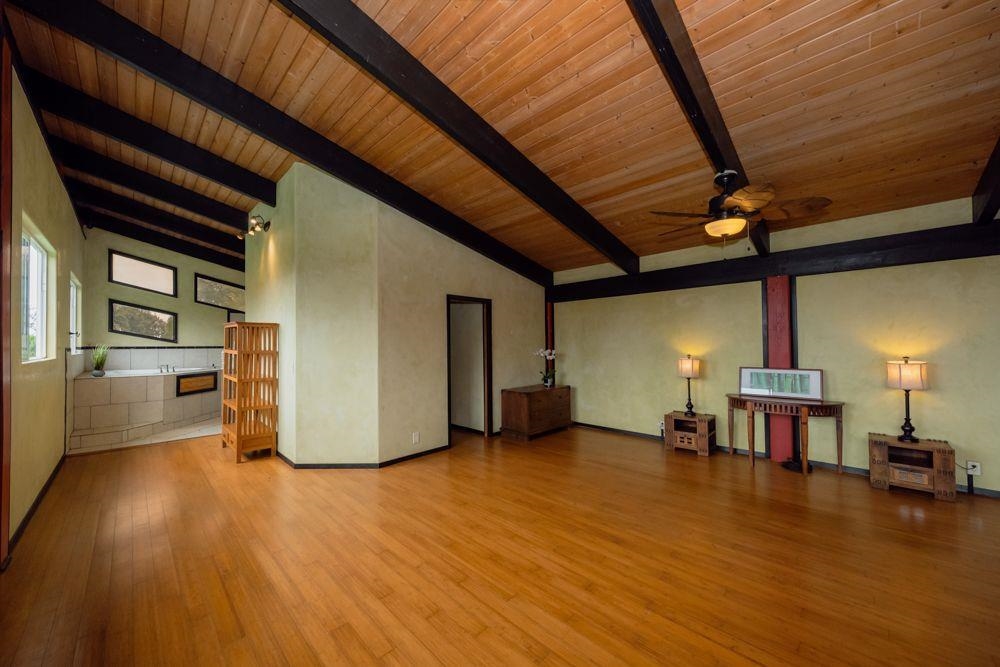 59 Door Of Faith Road Haiku, HI 96708 - Photo 17 of 45 a view of empty room with wooden floor