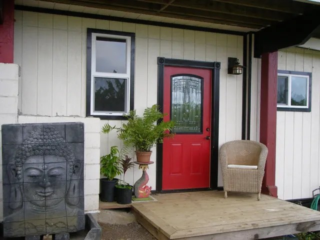 a view of a chairs and table in a yard