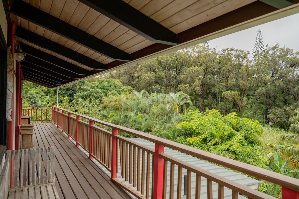 59 Door Of Faith Road Haiku, HI 96708 - Photo 20 of 45 a view of a balcony with wooden floor