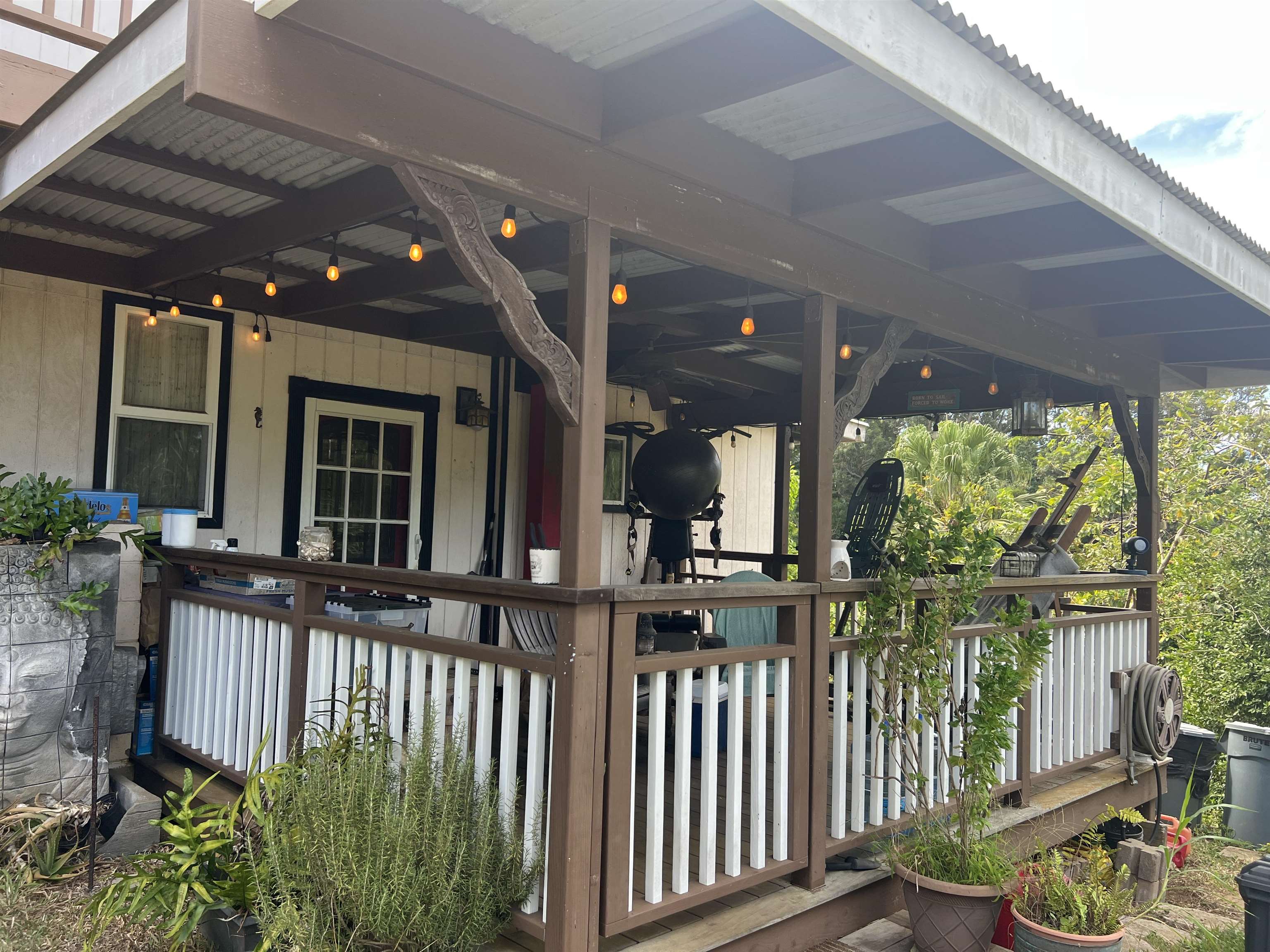 59 Door Of Faith Road Haiku, HI 96708 - Photo 22 of 45 a view of a porch with wooden floor