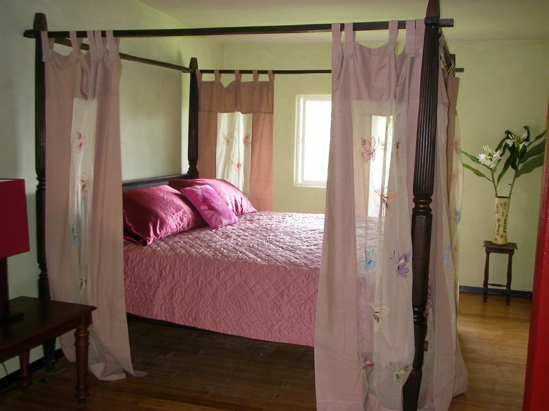 59 Door Of Faith Road Haiku, HI 96708 - Photo 25 of 45 a bedroom with a bed and a mirror