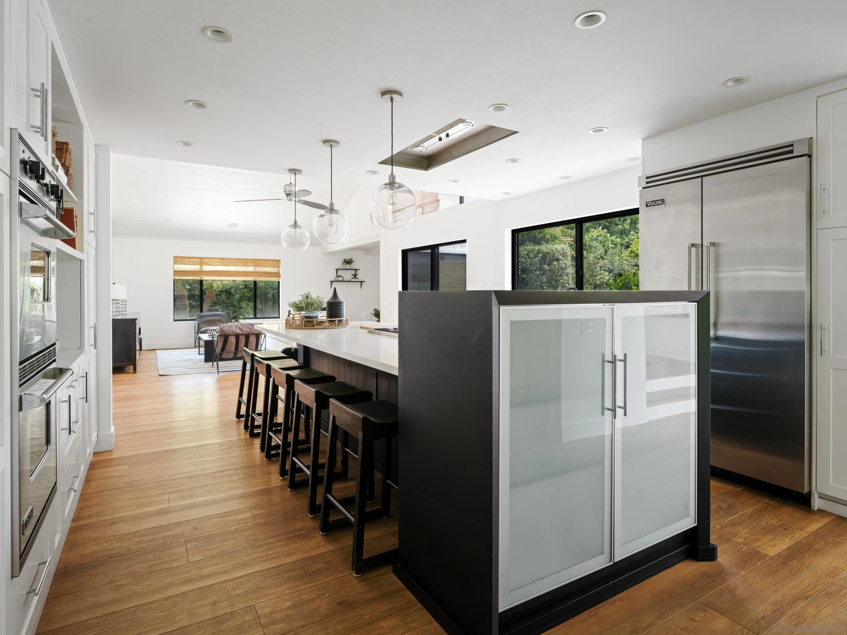 3520 Silvergate Place San Diego, CA 92106 - Photo 11 of 35 a kitchen with stainless steel appliances a refrigerator stove microwave and cabinets
