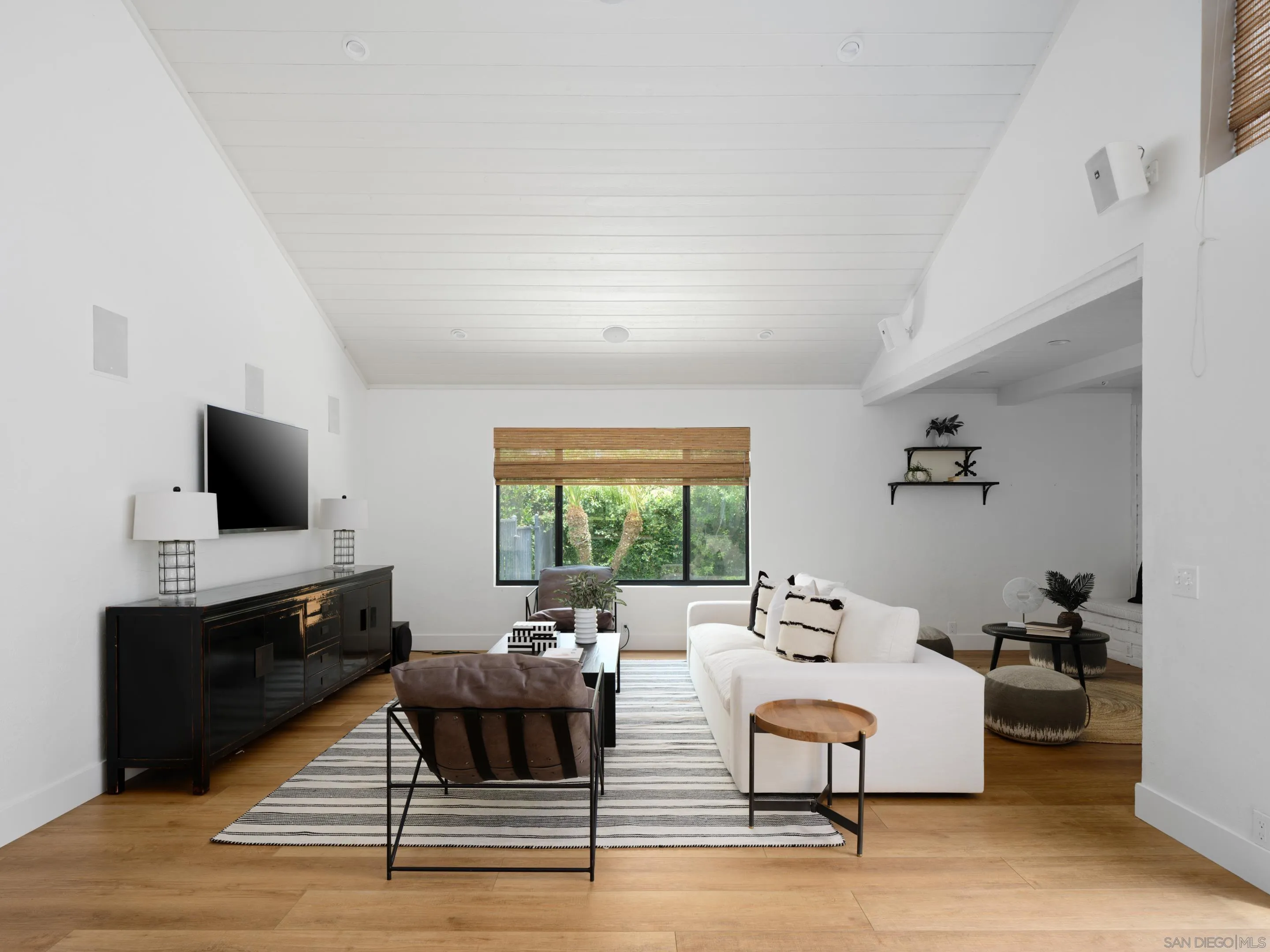 3520 Silvergate Place San Diego, CA 92106 - Photo 12 of 35 a living room with furniture a flat screen tv and a window