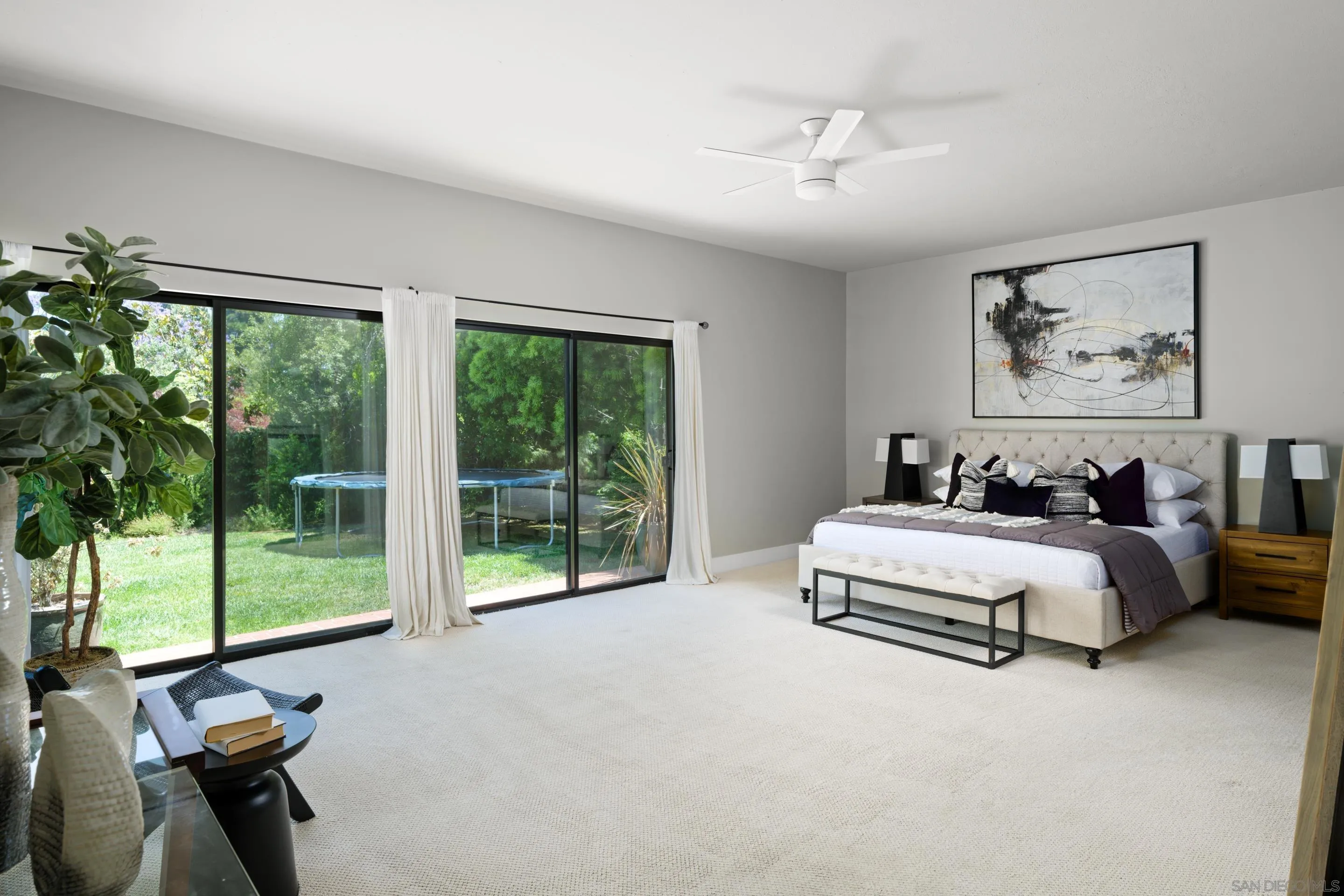 3520 Silvergate Place San Diego, CA 92106 - Photo 15 of 35 a spacious bedroom with a bed and a large window