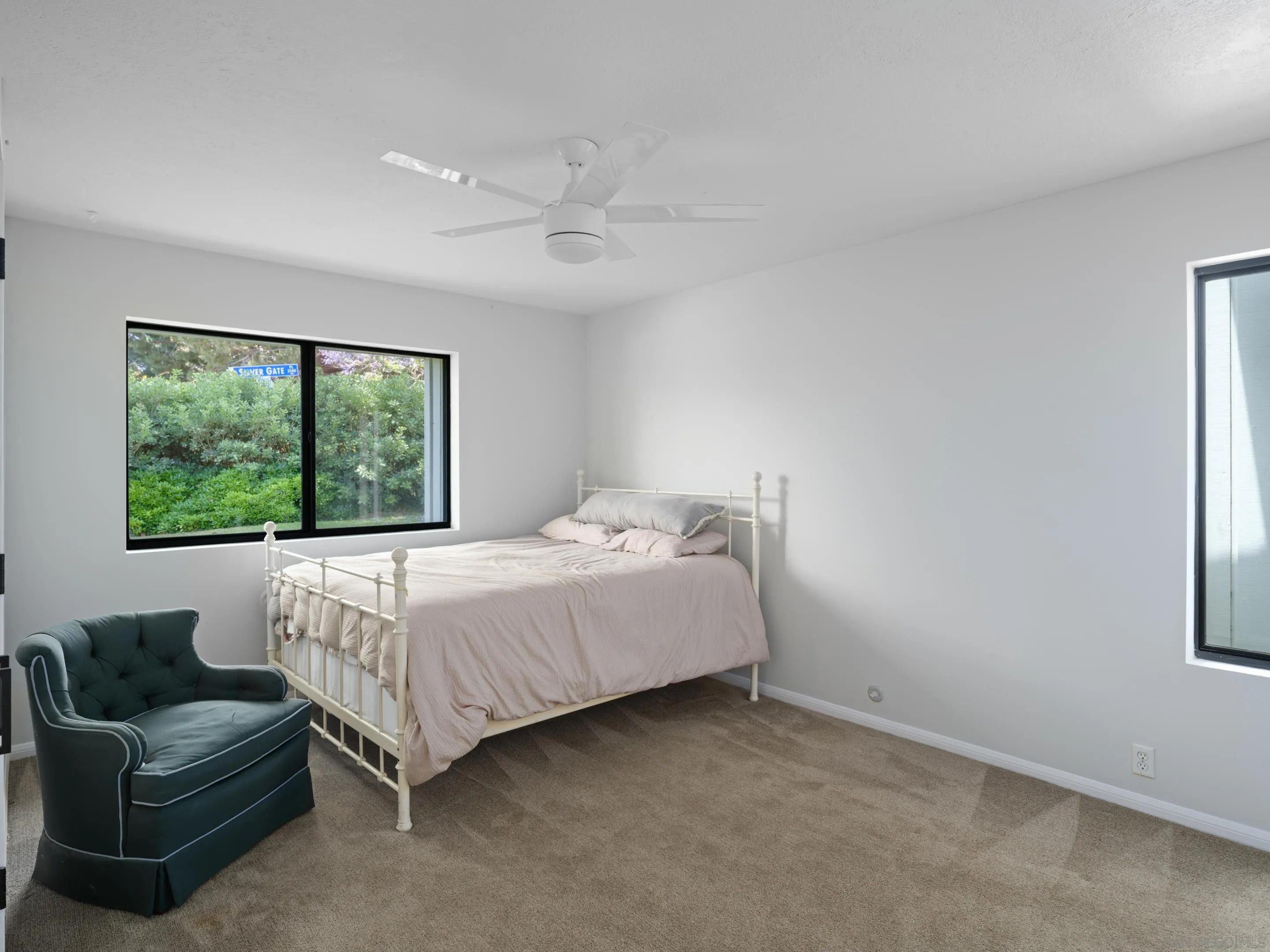 3520 Silvergate Place San Diego, CA 92106 - Photo 20 of 35 a spacious bedroom with a bed and a couch