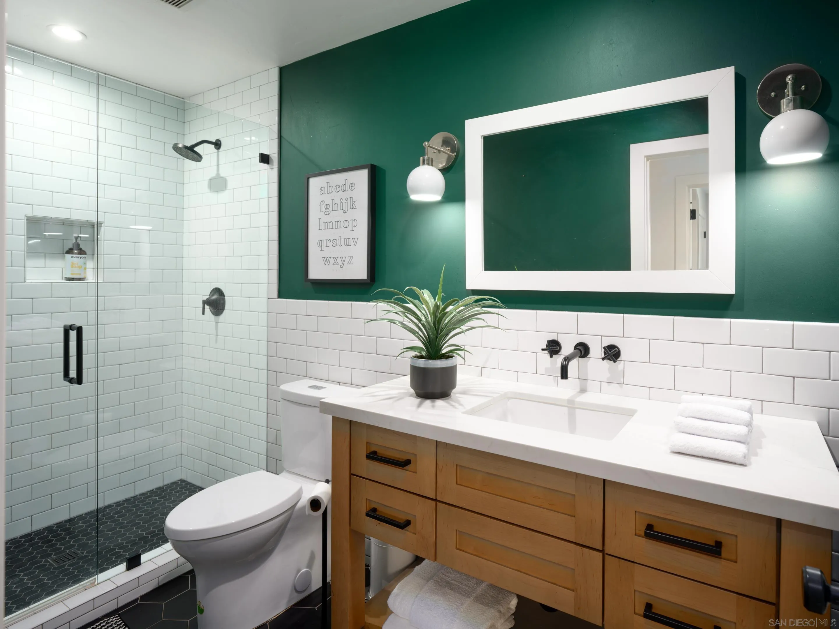 3520 Silvergate Place San Diego, CA 92106 - Photo 23 of 35 a bathroom with a granite countertop sink toilet and shower