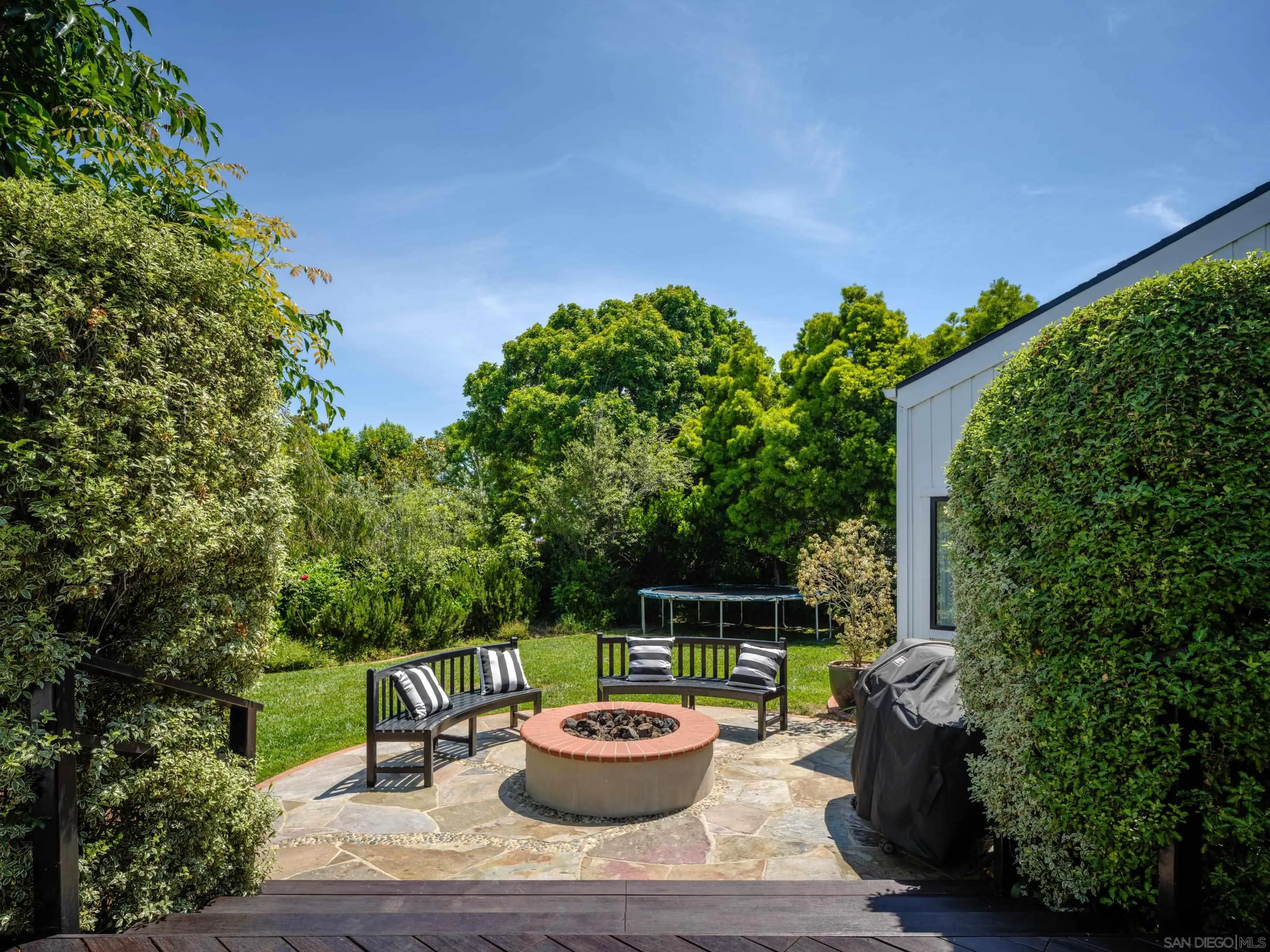3520 Silvergate Place San Diego, CA 92106 - Photo 29 of 35 a backyard of a house with fire pit and outdoor seating