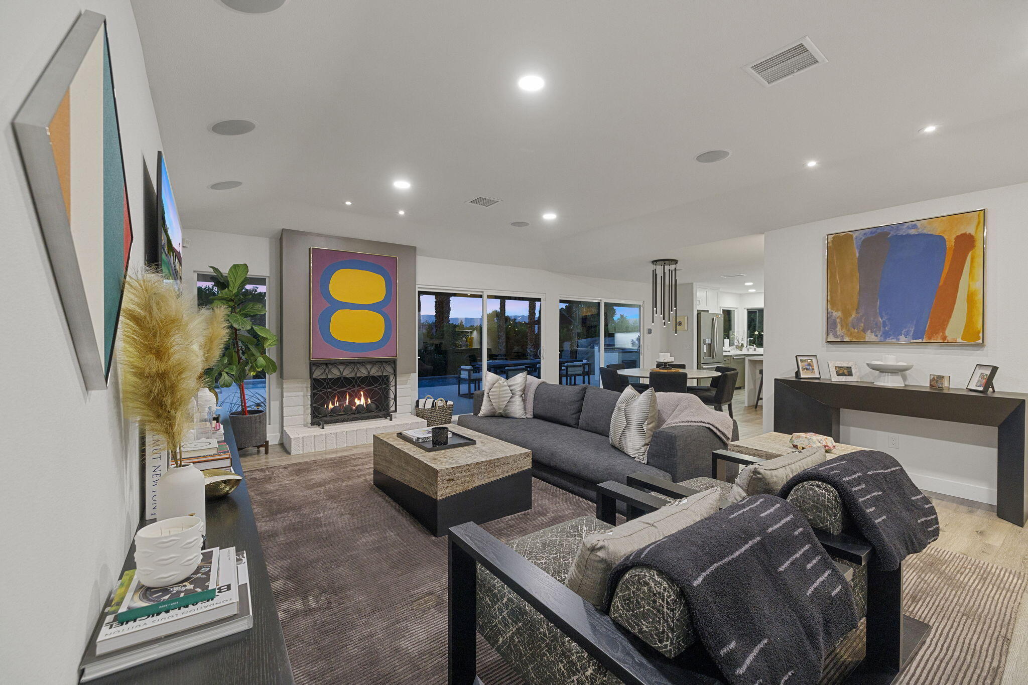 72790 Deer Grass Drive Palm Desert, CA 92260 - Photo 11 of 39 a living room with fireplace furniture and a large window