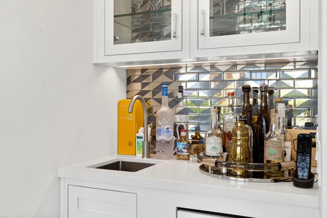 a view of a bathroom with a sink and mirror