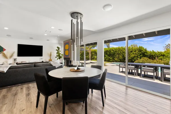 a view of a dining room with furniture window and outside view