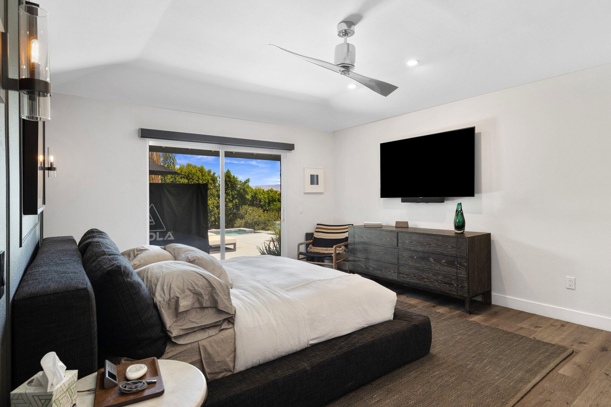 72790 Deer Grass Drive Palm Desert, CA 92260 - Photo 18 of 39 a bedroom with a bed and a flat screen tv