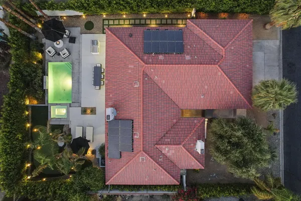 an aerial view of houses with yard
