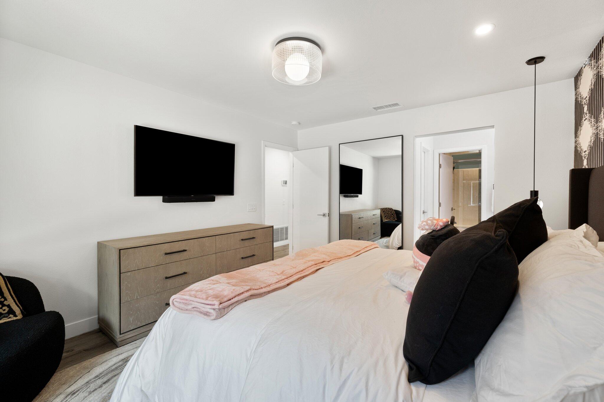 72790 Deer Grass Drive Palm Desert, CA 92260 - Photo 24 of 39 a bedroom with a bed and a flat screen tv