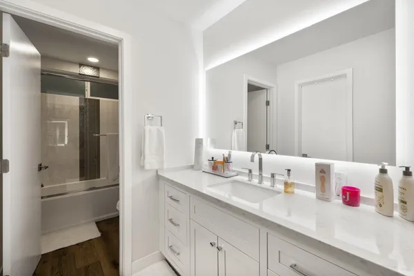 a bathroom with a sink and a mirror
