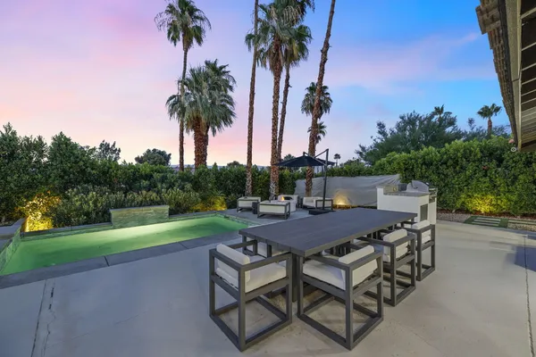 a view of an outdoor space with garden and patio