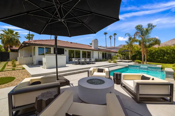 a view of a swimming pool with a patio