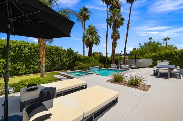 a view of yard with patio