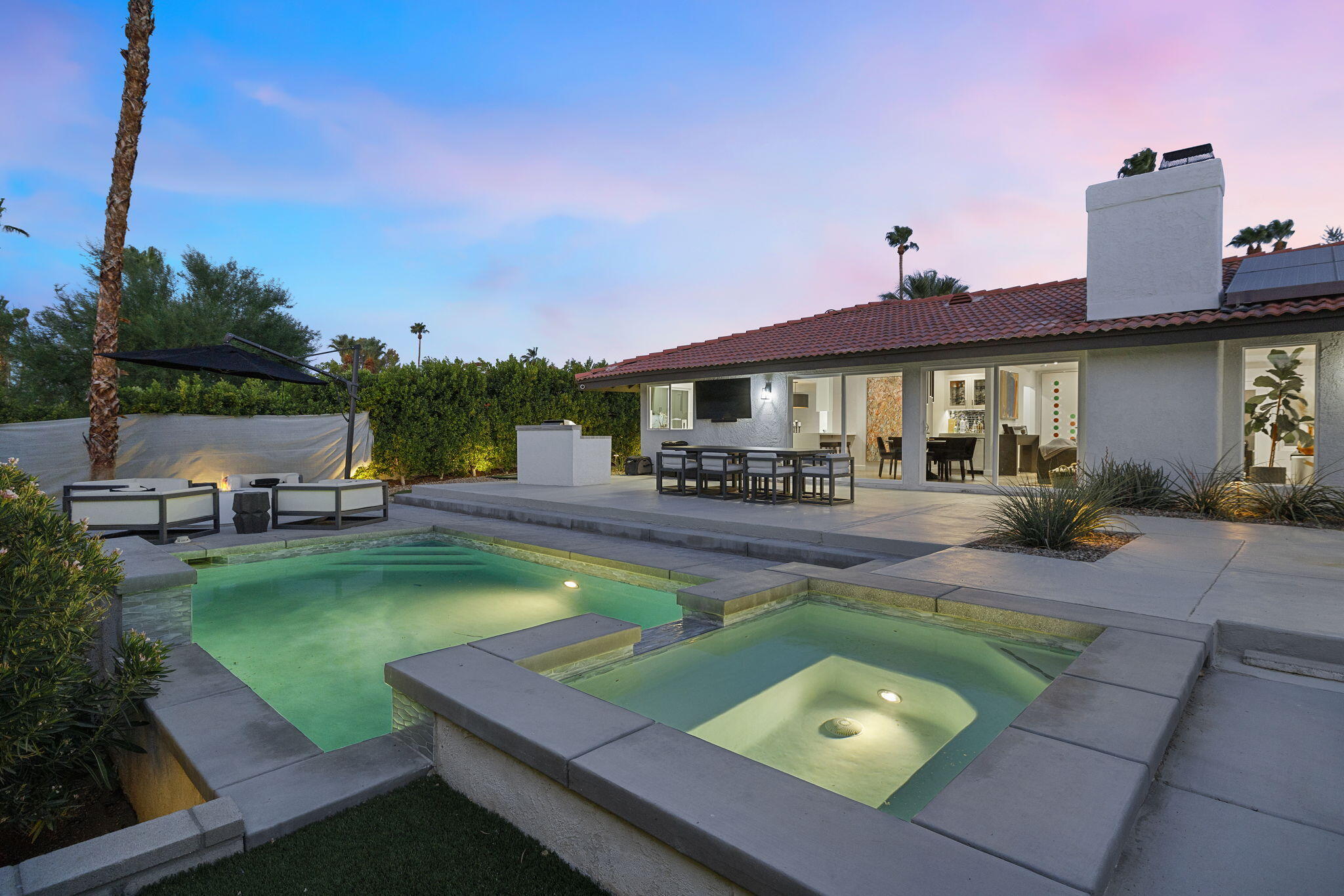 72790 Deer Grass Drive Palm Desert, CA 92260 - Photo 34 of 39 a view of a swimming pool with chairs