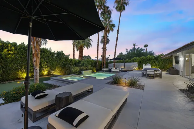 a view of yard with patio