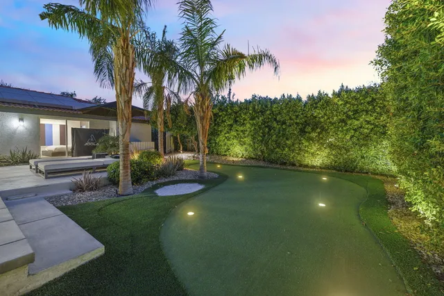 a view of a swimming pool with a patio