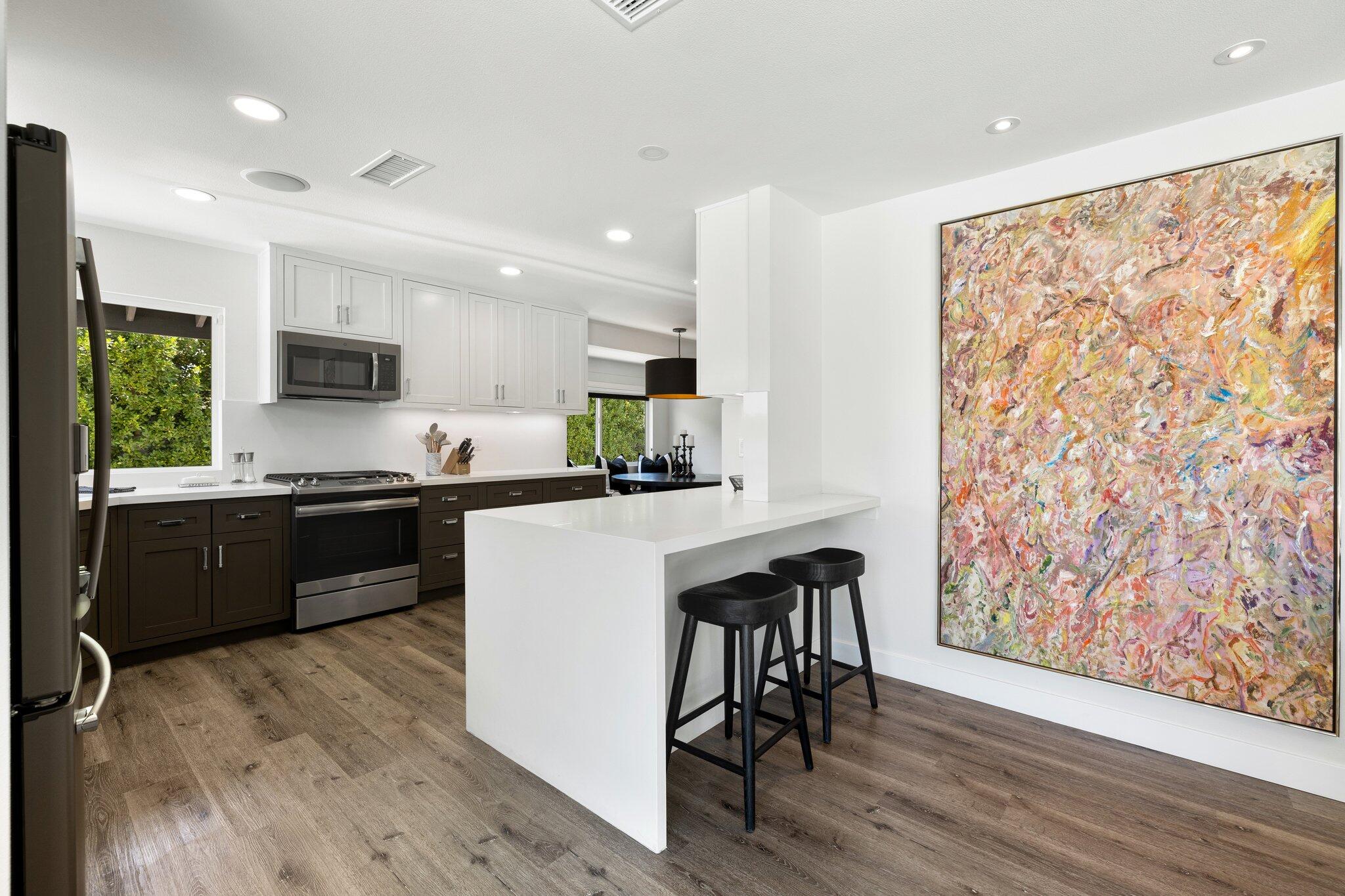 72790 Deer Grass Drive Palm Desert, CA 92260 - Photo 4 of 39 a kitchen with granite countertop a refrigerator stove top oven and sink