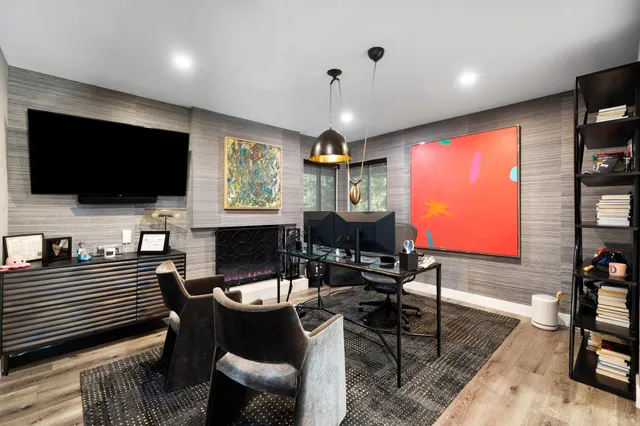 a outdoor living space with furniture and a flat screen tv