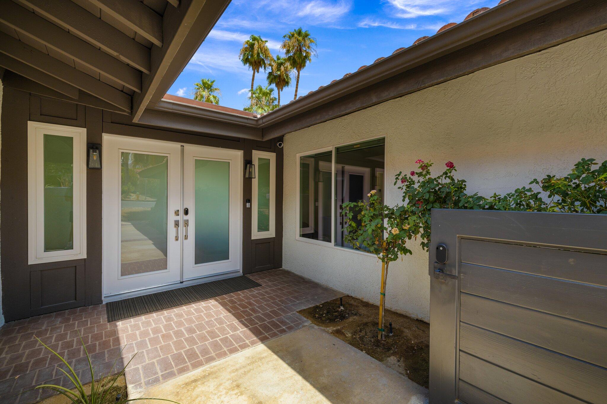 72790 Deer Grass Drive Palm Desert, CA 92260 - Photo 8 of 39 a view of a entryway door front of house