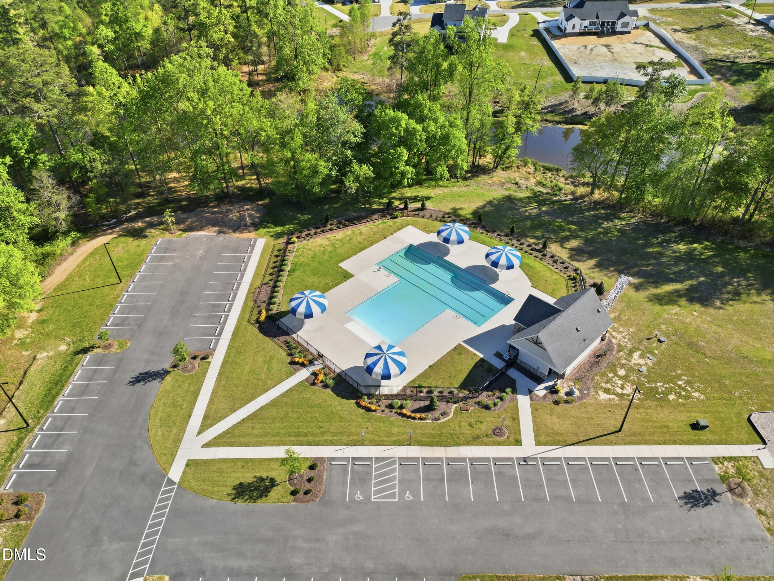 386 Howards Crossing Drive Wendell, NC 27591 - Photo 28 of 31 an aerial view of a house with swimming pool large trees and lawn chairs