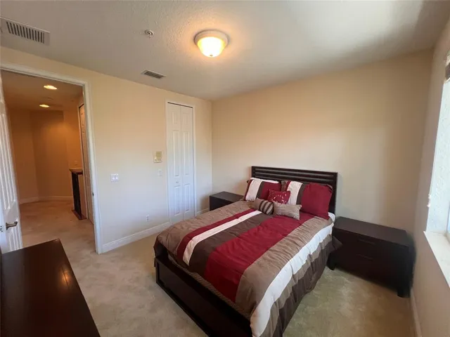 a bedroom with a bed and a walk in closet