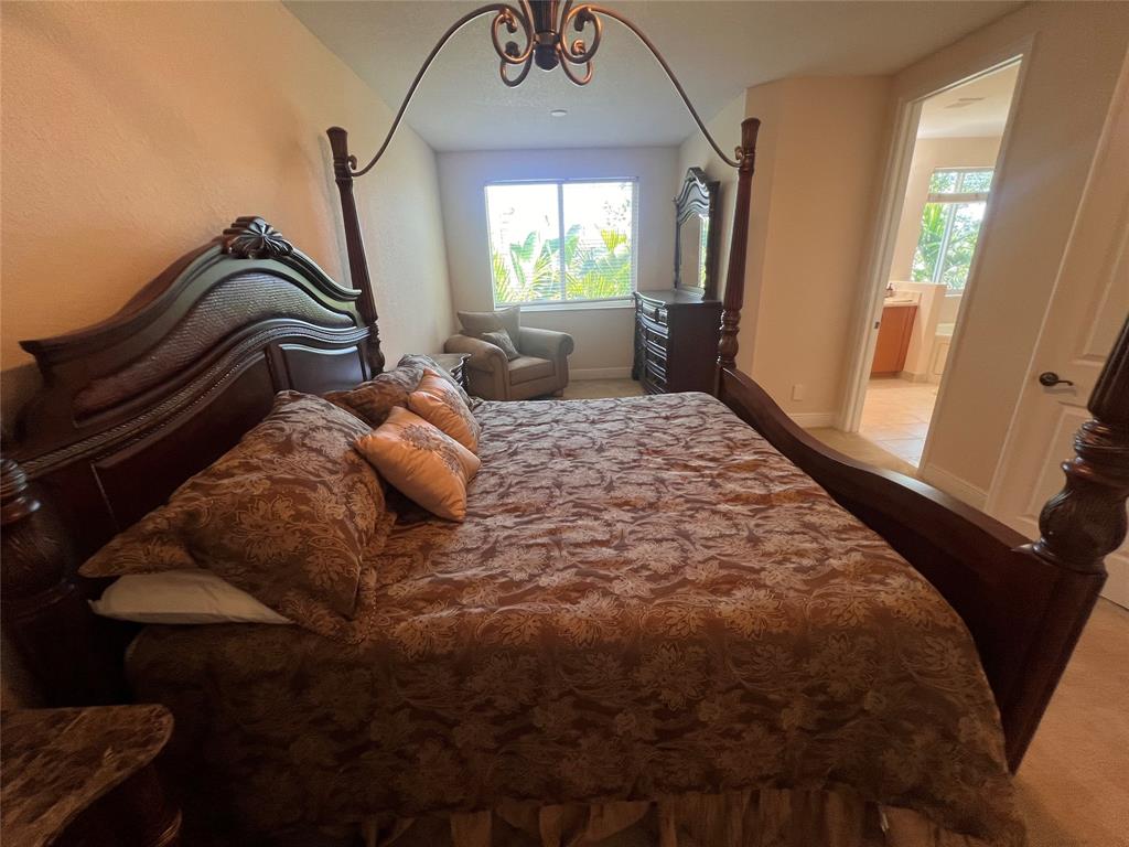 3014 Waterside Circle Boynton Beach, FL 33435 - Photo 15 of 40 a bedroom with a bed and window