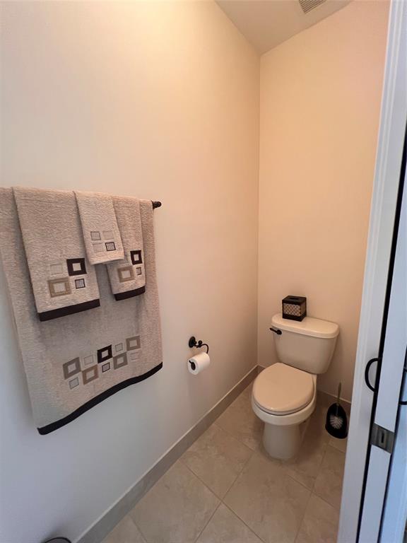 3014 Waterside Circle Boynton Beach, FL 33435 - Photo 21 of 40 a bathroom with a toilet and a mirror