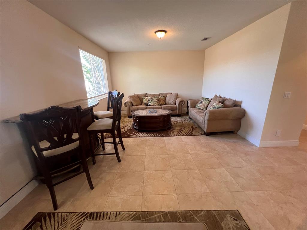 3014 Waterside Circle Boynton Beach, FL 33435 - Photo 23 of 40 a living room with furniture and a rug