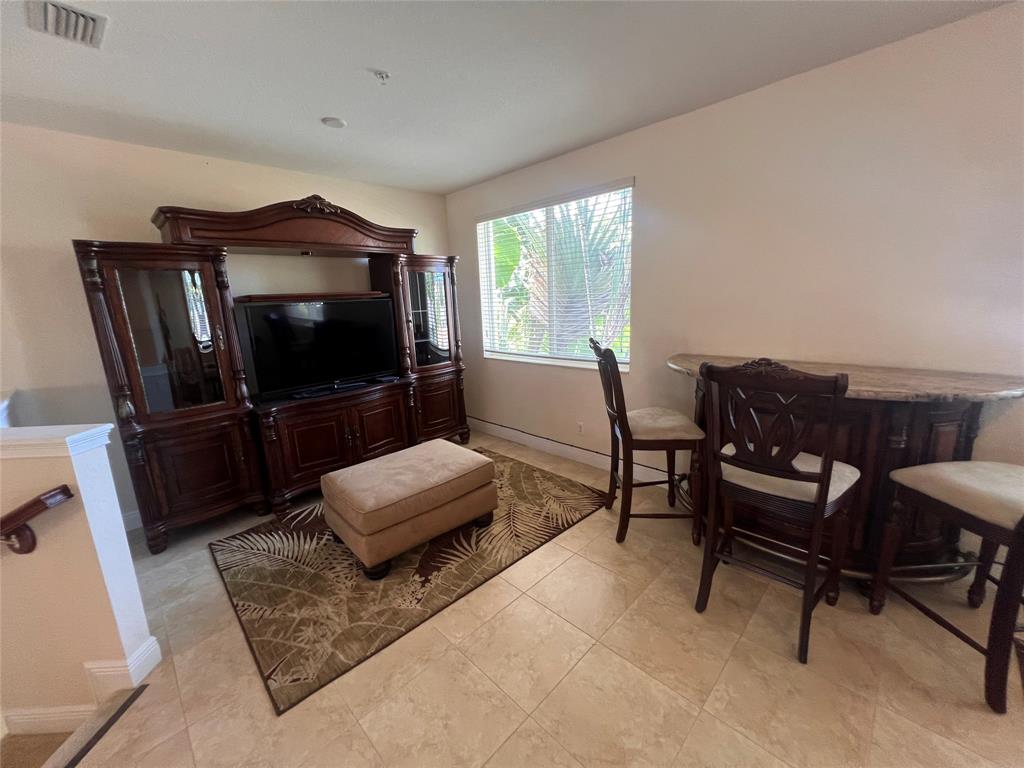 3014 Waterside Circle Boynton Beach, FL 33435 - Photo 25 of 40 a living room with furniture and a flat screen tv