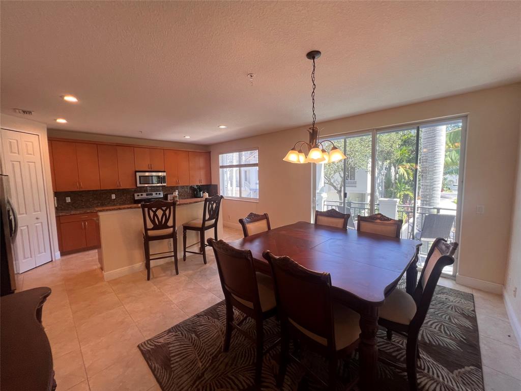 3014 Waterside Circle Boynton Beach, FL 33435 - Photo 28 of 40 a view of a dining room with furniture window and wooden floor