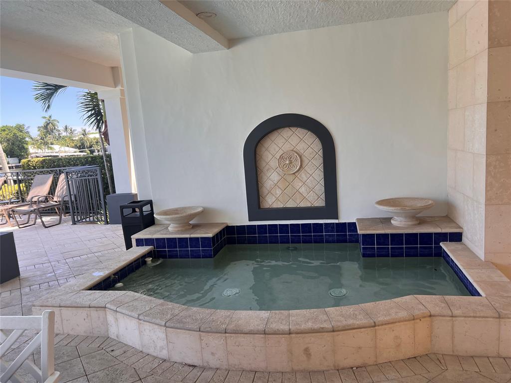 3014 Waterside Circle Boynton Beach, FL 33435 - Photo 36 of 40 a living room with fireplace furniture and a floor to ceiling window
